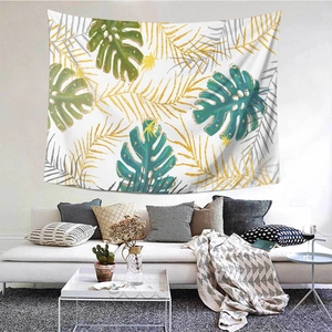 Dettaglio di un arazzo nordico con stampa di foglie tropicali di palma e monstera
