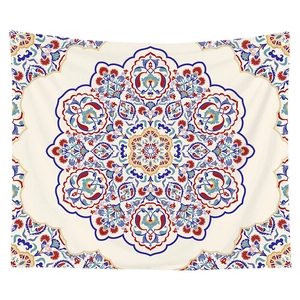 Detailed view of bohemian mandala tapestry featuring symmetrical red and blue floral patterns