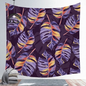 Detail of tropical monstera leaf tapestry with vibrant purple and orange color accents