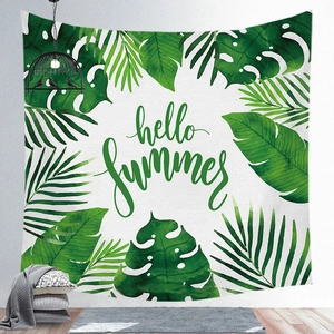 Detail showing tropical monstera leaves and Hello Summer text on wall hanging tapestry
