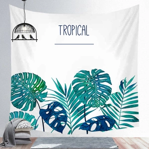 Detailed view of Nordic tropical monstera leaf wall tapestry in a cozy home setting