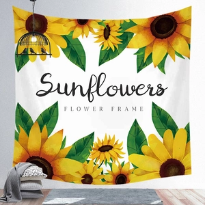 Detailed view of sunflower tapestry hanging on a white wall with cozy home decor accents