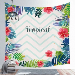 Detail of tropical monstera leaf print tapestry with stylish cursived Tropical lettering
