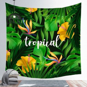 Detail of tropical plant tapestry featuring green leaves, hibiscus flowers and bird of paradise