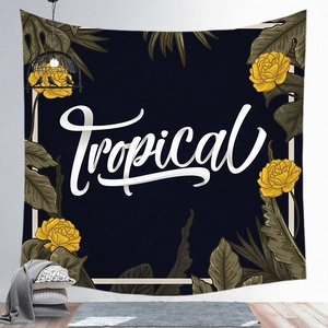 Detailed close-up of tropical wall tapestry with yellow floral patterns and blue background