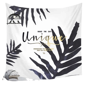 Minimalist black and white tropical leaf tapestry with artistic gold lettering for home decor