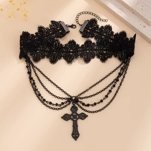 Detail of gothic black lace choker featuring layered metal chains and a vintage cross pendant