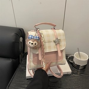 Pink and beige plaid backpack for girls with shelliemay plush charm and star buckle detail