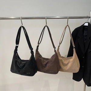 Minimalist half-moon shoulder bags in black, coffee, and beige with adjustable straps