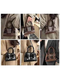 Détail du sac cabas à carreaux élégant avec poignées en cuir et bandoulière réglable