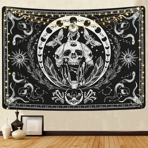 Bohemian gothic tapestry with moon phases, skulls and mystic sun motifs on wall