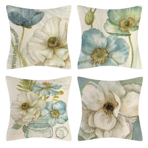 Detailansicht von vier Vintage-Leinenkissenbezügen mit Aquarell-Blumenmustern