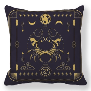 Macro detail of zodiac cushion with golden Cancer crab and moon on navy peach skin fabric