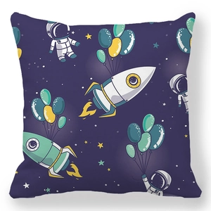 Detail of soft peach skin cushion cover with cute cartoon astronaut and rocket print