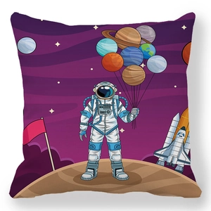 Close-up of peach skin pillow cover featuring a cartoon astronaut and purple galaxy print