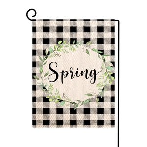 Detailed texture of burlap garden flag with buffalo check pattern and Spring wreath