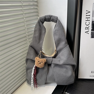 Grey corduroy tote bag with bow detail and teddy bear charm for autumn and winter