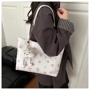 Floral shoulder tote with rose patterns, chain strap, and cute plush cloud pendant