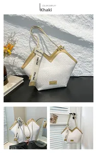 Dettaglio della borsa tote kaki con trama intrecciata bianca e rifiniture in pelle