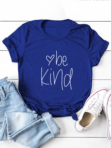 Royal blue 'be kind' t-shirt with front knot detail and heart print on white wood background