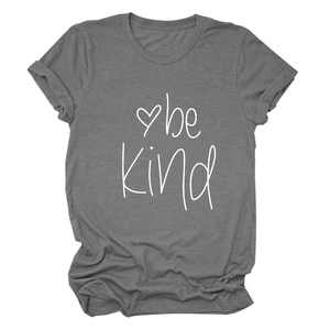 Detailed flat lay of a grey cotton T-shirt featuring a white 'be kind' print and heart icon