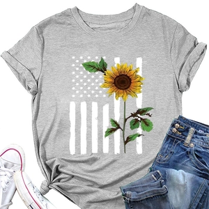 Flat lay of gray t-shirt with sunflower flag print paired with jeans and sneakers