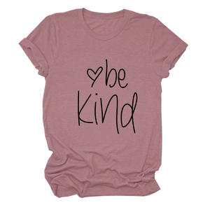 Detail of the 'be kind' print and heart design on a dusty pink crew neck cotton t-shirt