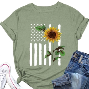 Flat lay of olive green t-shirt with American flag sunflower print and casual denim