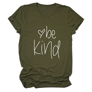 Flat lay of an olive green short sleeve t-shirt with be Kind printed and heart graphic