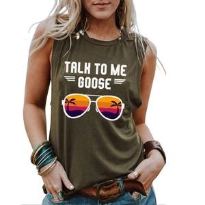 Close-up of Talk To Me Goose letter print and aviator glasses on military green tank top