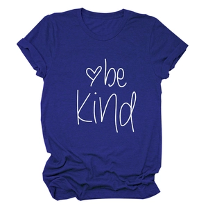 Detail shot of navy blue cotton t-shirt featuring be kind script and heart graphic