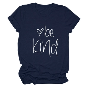Detail of navy blue t-shirt with white 'be kind' slogan and small heart print