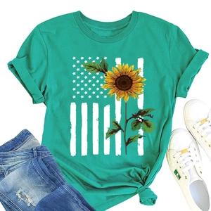 Detail of teal crewneck t-shirt featuring a sunflower and American flag print flat lay