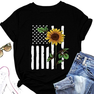 Flat lay of sunflower American flag print T-shirt with denim shorts and sunglasses