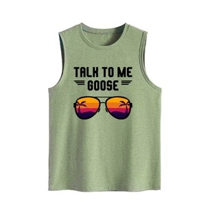 Close-up of Talk To Me Goose text and pilot sunglasses print on light green tank top