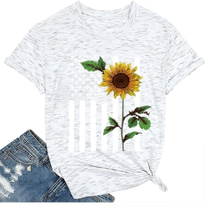 Detail of sunflower and star-stripe print on women's grey t-shirt with side knot hem