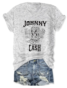 Detail of Johnny Cash graphic t-shirt with vintage denim shorts in a flat lay style