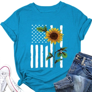 Flat lay of sky blue sunflower flag print T-shirt with white sneakers and jeans