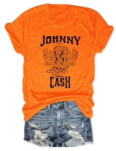Detail of Johnny Cash graphic t-shirt with floral cowboy boots print and denim shorts
