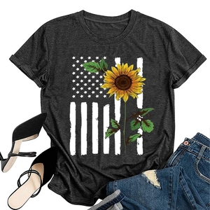 Flat lay of grey sunflower flag print T-shirt styled with jeans and high heels