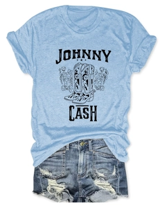 Flat lay of Johnny Cash sky blue t-shirt with floral boots print and denim shorts