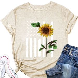 Detail of sunflower print T-shirt with knotted hem and stylish casual outfit pairing