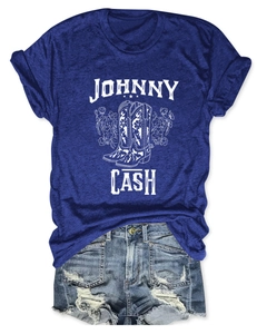 Flat lay of royal blue t-shirt with Johnny Cash lettering and western floral boot graphic