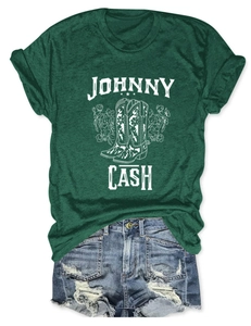 Detailed flat lay of Johnny Cash graphic T-shirt with distressed denim shorts