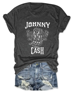 Close-up of Johnny Cash graphic print on a charcoal grey t-shirt with denim shorts