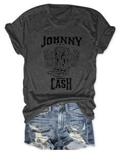 Detail of Johnny Cash graphic print on charcoal grey tee with vintage boots and floral art