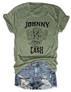 Flat lay of Johnny Cash graphic tee with floral boots design and blue denim shorts