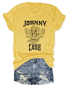 Detail view of Johnny Cash floral boots graphic on a yellow cotton t-shirt for women