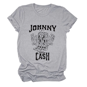 Detail of grey Johnny Cash graphic t-shirt with vintage cowboy boots and floral design
