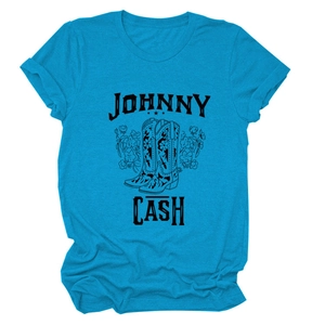 Close-up of Johnny Cash graphic on blue t-shirt with floral cowboy boots and western text